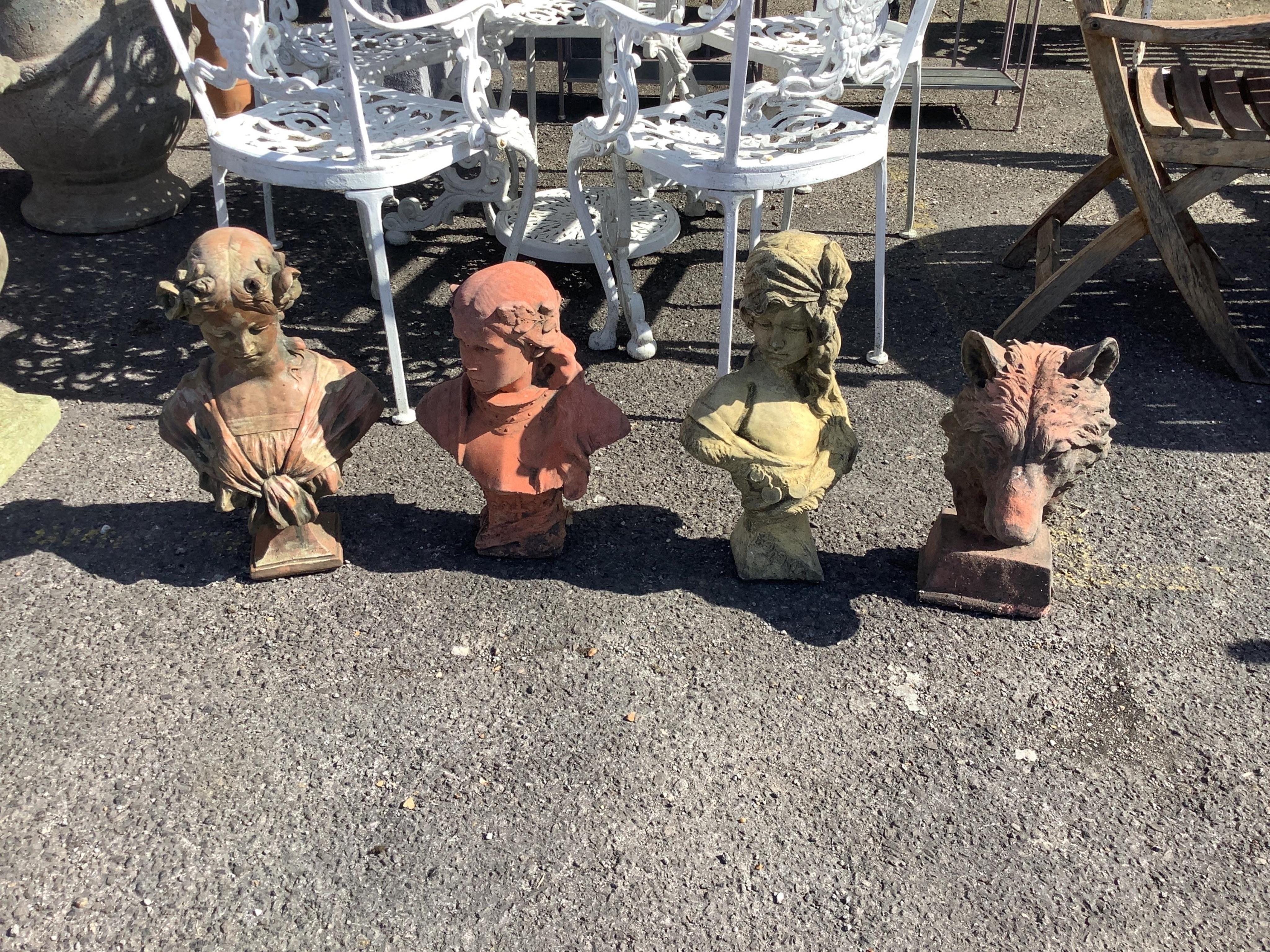 Four cast stone and terracotta garden busts, largest height 46cm